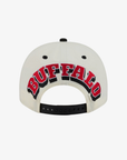 New Era Buffalo Sabres cream 9FIFTY snapback hat featuring oversized red, white, and black BUFFALO arch embroidery above a black adjustable snapback closure.