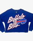 New Era women's Buffalo Bills royal blue cropped long sleeve T-shirt featuring oversized white Bills script and charging buffalo logo