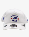 New Era Buffalo Bills white 19TWENTY adjustable hat with embroidered 1960 heritage patch, vintage Bills logo, curved visor, and NFL side embroidery.