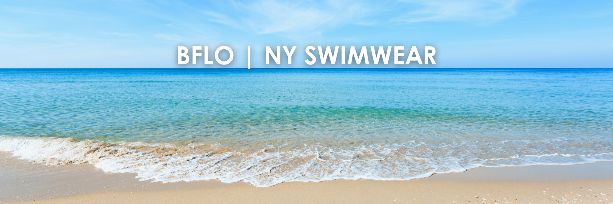 stock photo a beach and ocean with title reading BFLO | ny swimwear