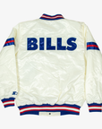 Back view of Starter Buffalo Bills cream satin varsity jacket featuring oversized royal blue BILLS lettering, blue and red sleeve stripes, and matching rib-knit collar, cuffs, and waistband.