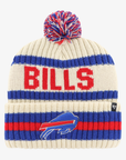 '47 Brand Buffalo Bills cream knit hat featuring royal blue and red horizontal stripes, large red BILLS lettering, embroidered charging buffalo logo, and multicolored yarn pom.