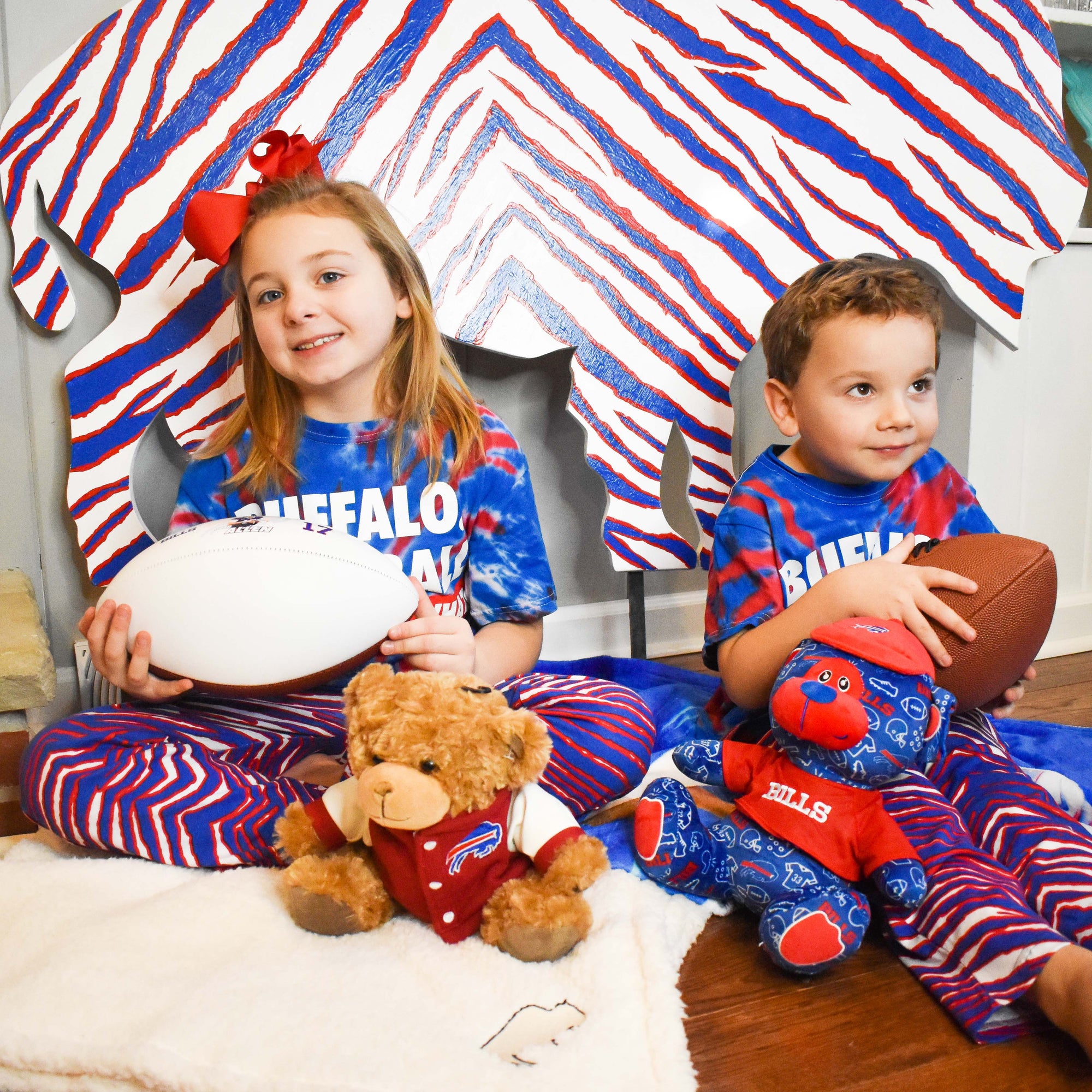 Buffalo Bills kids wearing children's Bills clothes and accessories. Shop on The BFLO website.