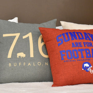 BFLO Store Sundays are For Football and 716 pillows on a bed
