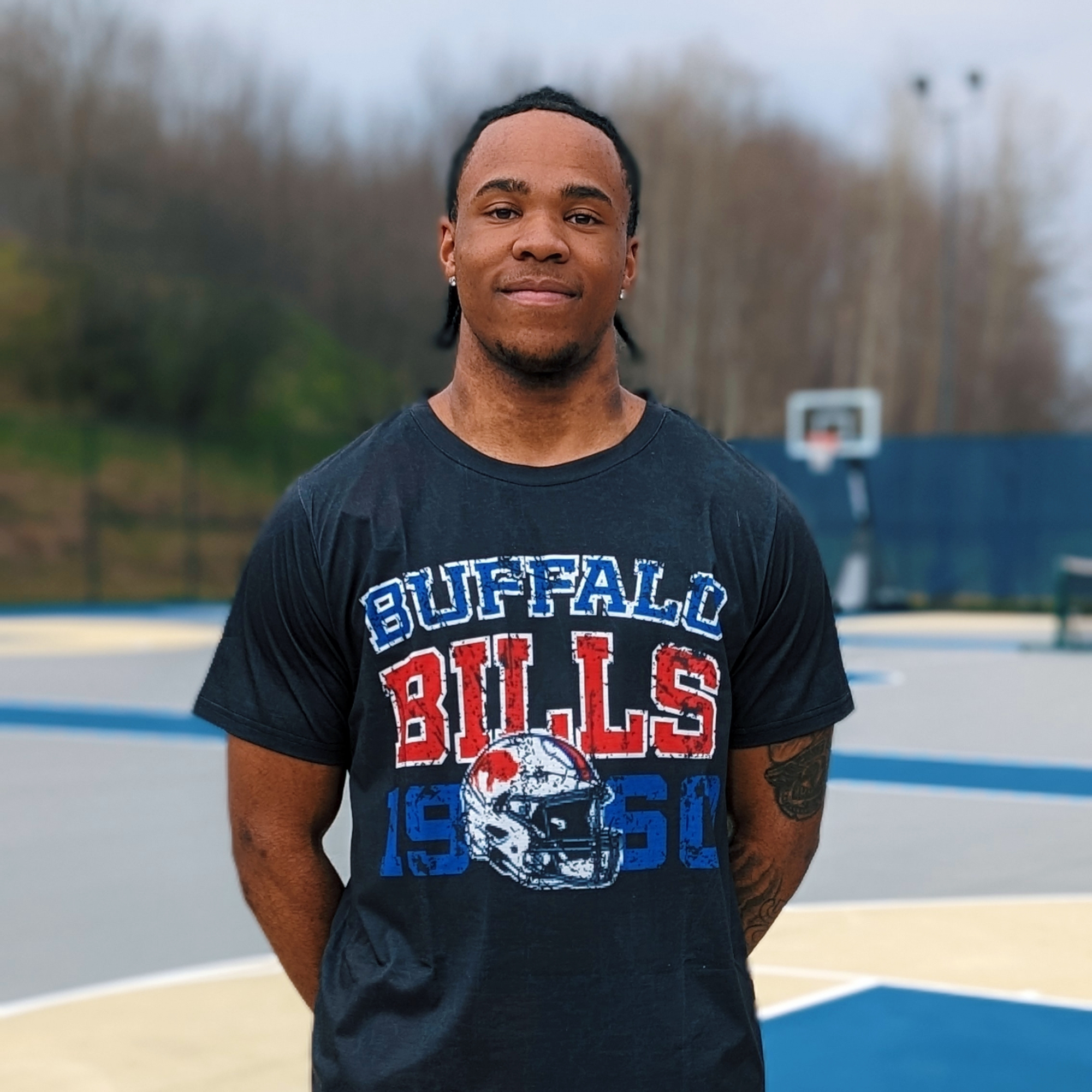 a man wearing a buffalo bills shirt