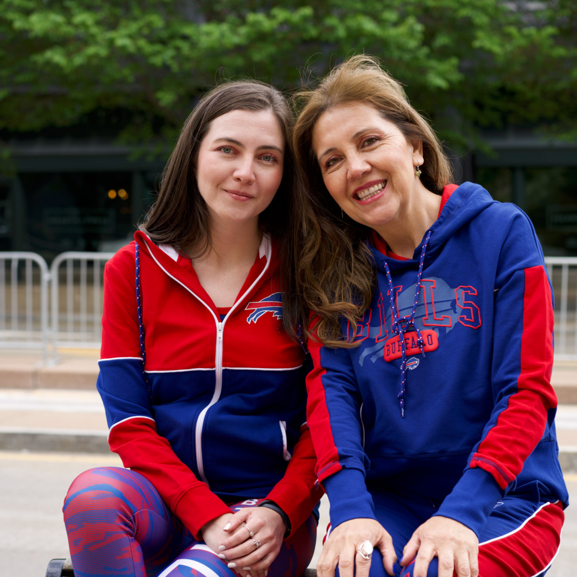 two women wearing buffalo bills clothing