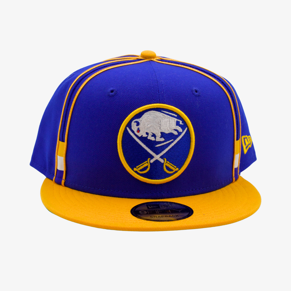 New Era Buffalo Sabres royal blue and gold 9FIFTY snapback hat featuring an embroidered crossed-swords logo, gold crown piping, and contrasting gold flat visor.