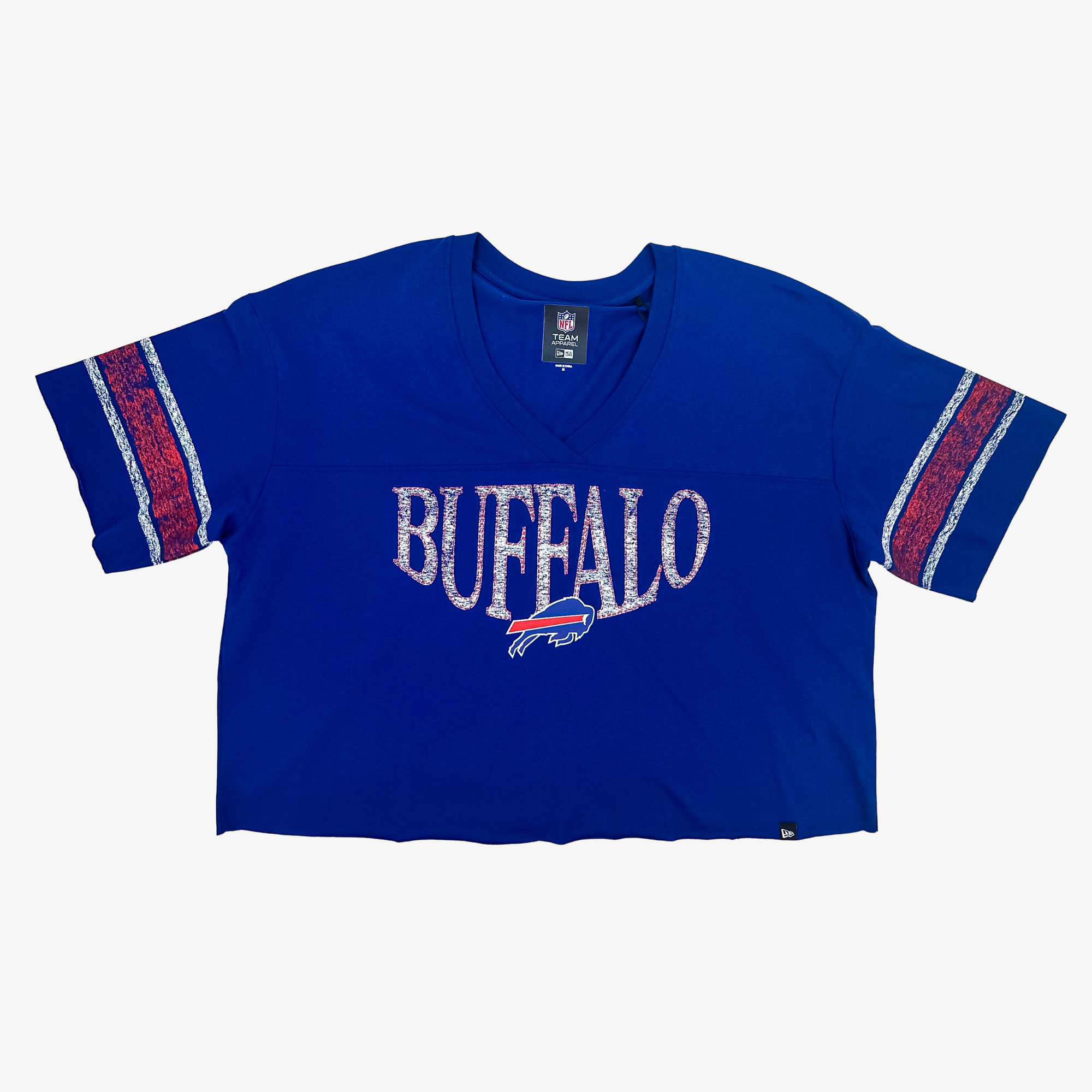 A royal blue Buffalo Bills cropped V-neck t-shirt with a distressed white 'BUFFALO' text graphic and red, white, and blue sleeve stripes, shown flat on a light gray background.
