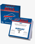 Buffalo Bills 2027 Daily Sports Desk Calendar featuring royal blue packaging with the charging buffalo logo and a January 1 calendar page displaying Bills trivia.