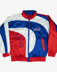 Pro Player Buffalo Bills retro windbreaker jacket featuring royal blue, red, and white curved colorblock panels, embroidered charging buffalo logo, outlined BILLS lettering, and full-zip front.