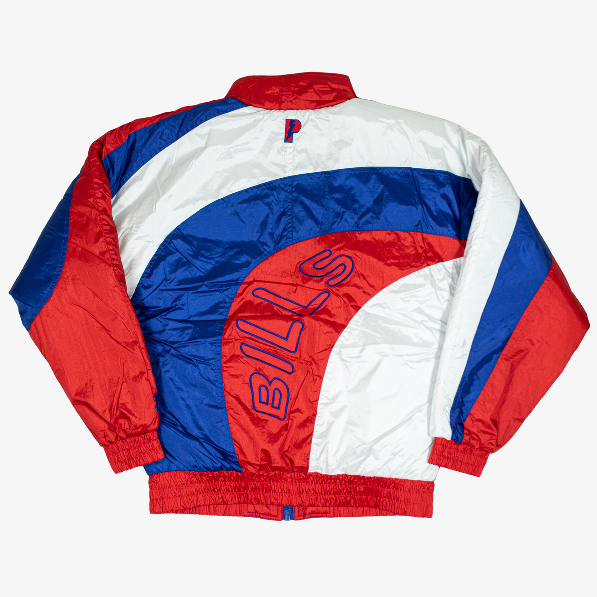 Back view of Pro Player Buffalo Bills retro colorblock windbreaker featuring sweeping royal blue, red, and white panels, oversized curved BILLS lettering, and elastic waistband.