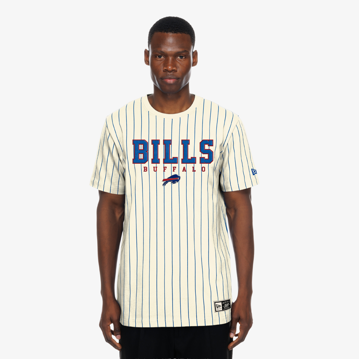 Man wearing a cream New Era Buffalo Bills T-shirt with blue pinstripes and Bills logo