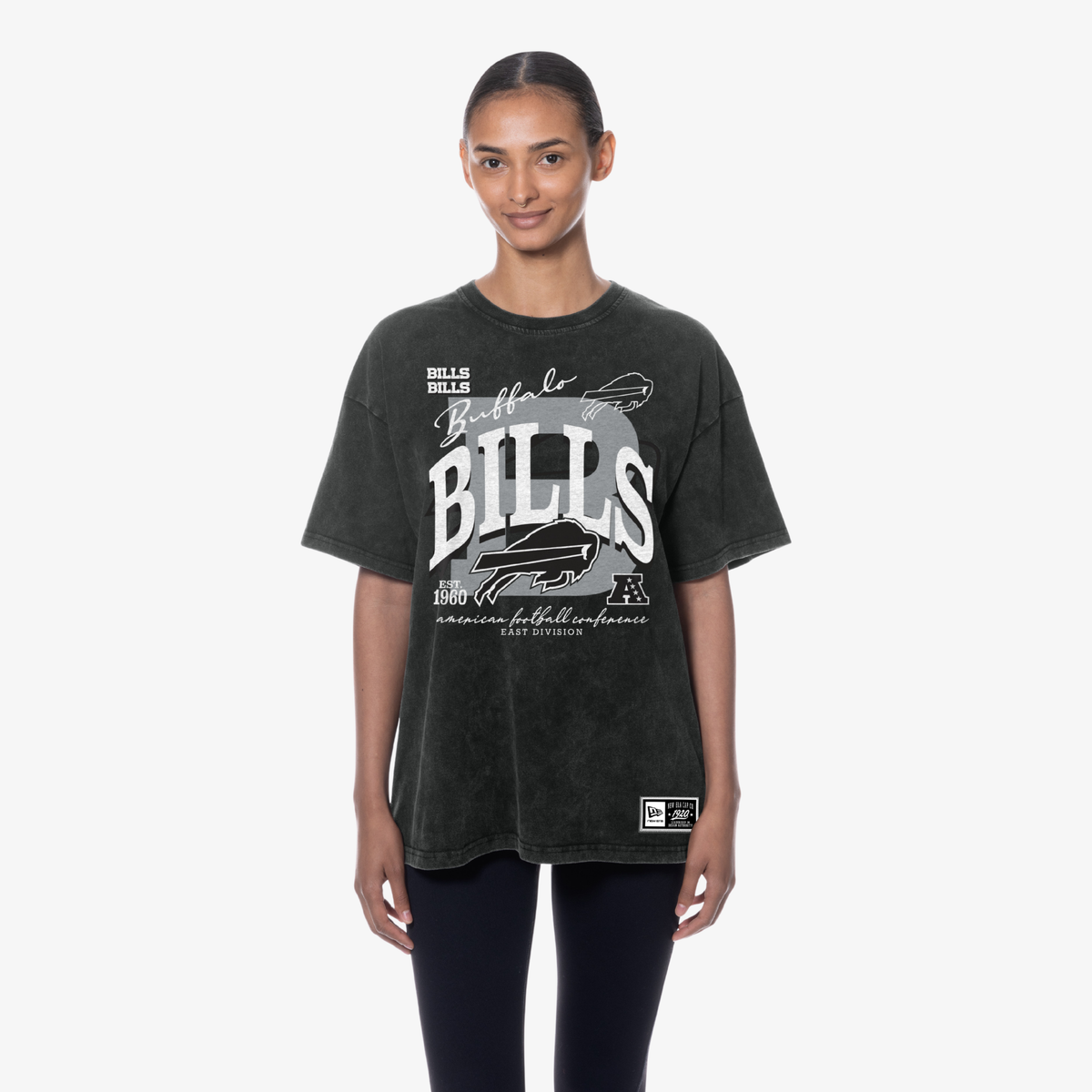 Woman wearing a New Era Buffalo Bills black vintage wash oversized T-shirt with white team graphics