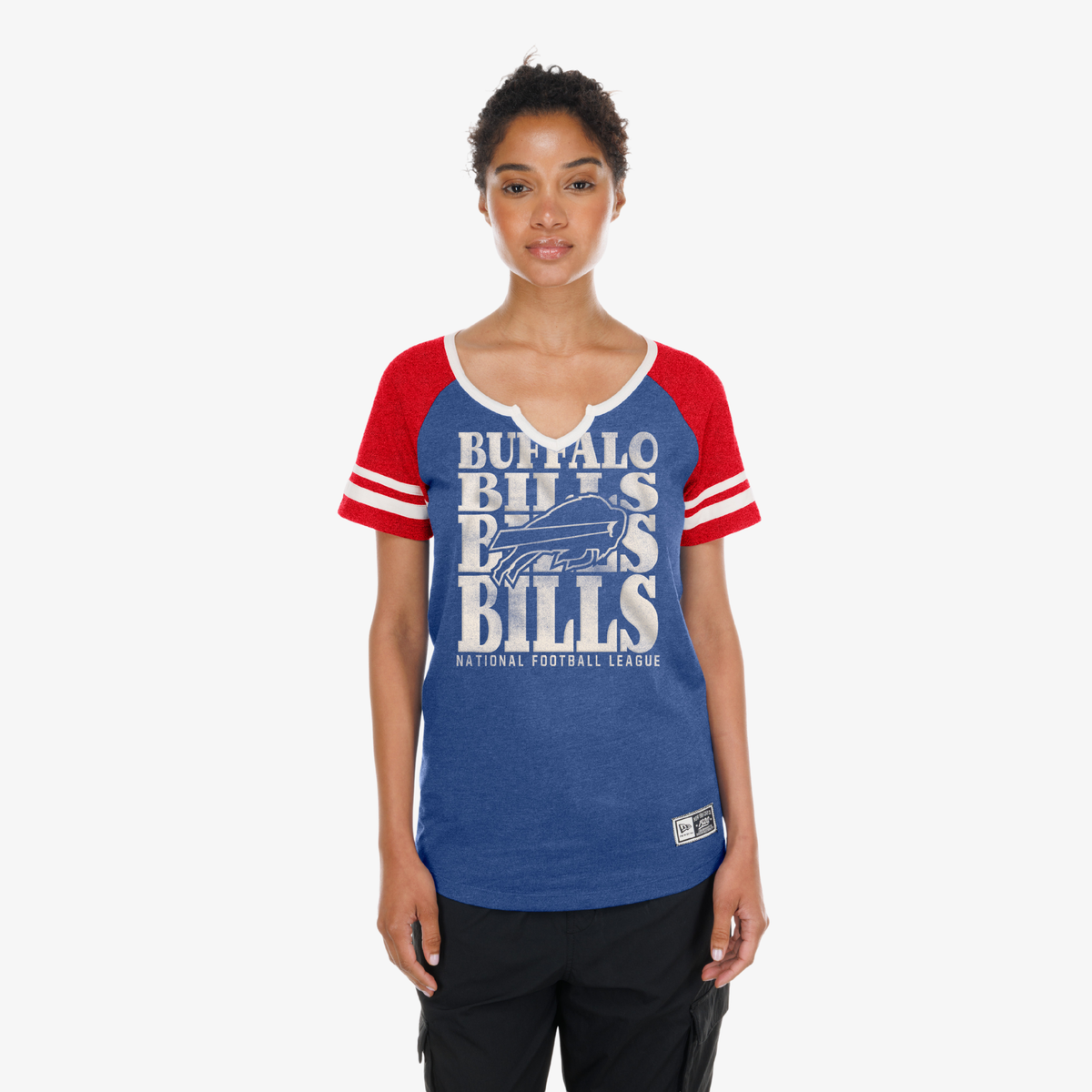 Woman wearing a New Era Buffalo Bills royal and red raglan T-shirt with repeat Bills graphic