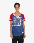 Woman wearing a New Era Buffalo Bills royal and red raglan T-shirt with repeat Bills graphic
