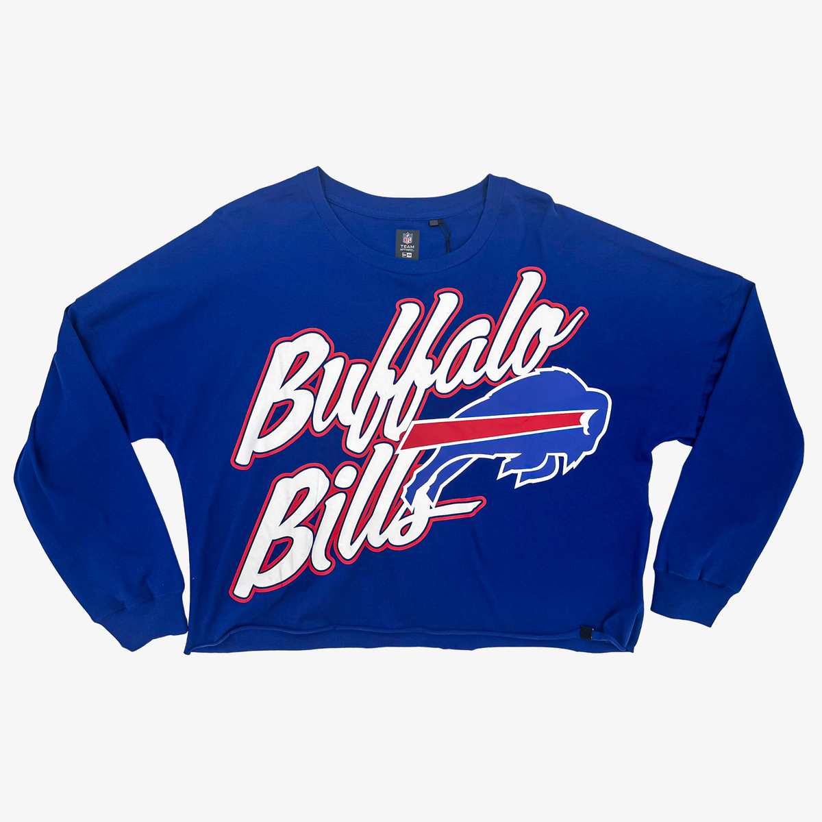 New Era women's Buffalo Bills royal blue cropped long sleeve T-shirt featuring oversized white Bills script and charging buffalo logo