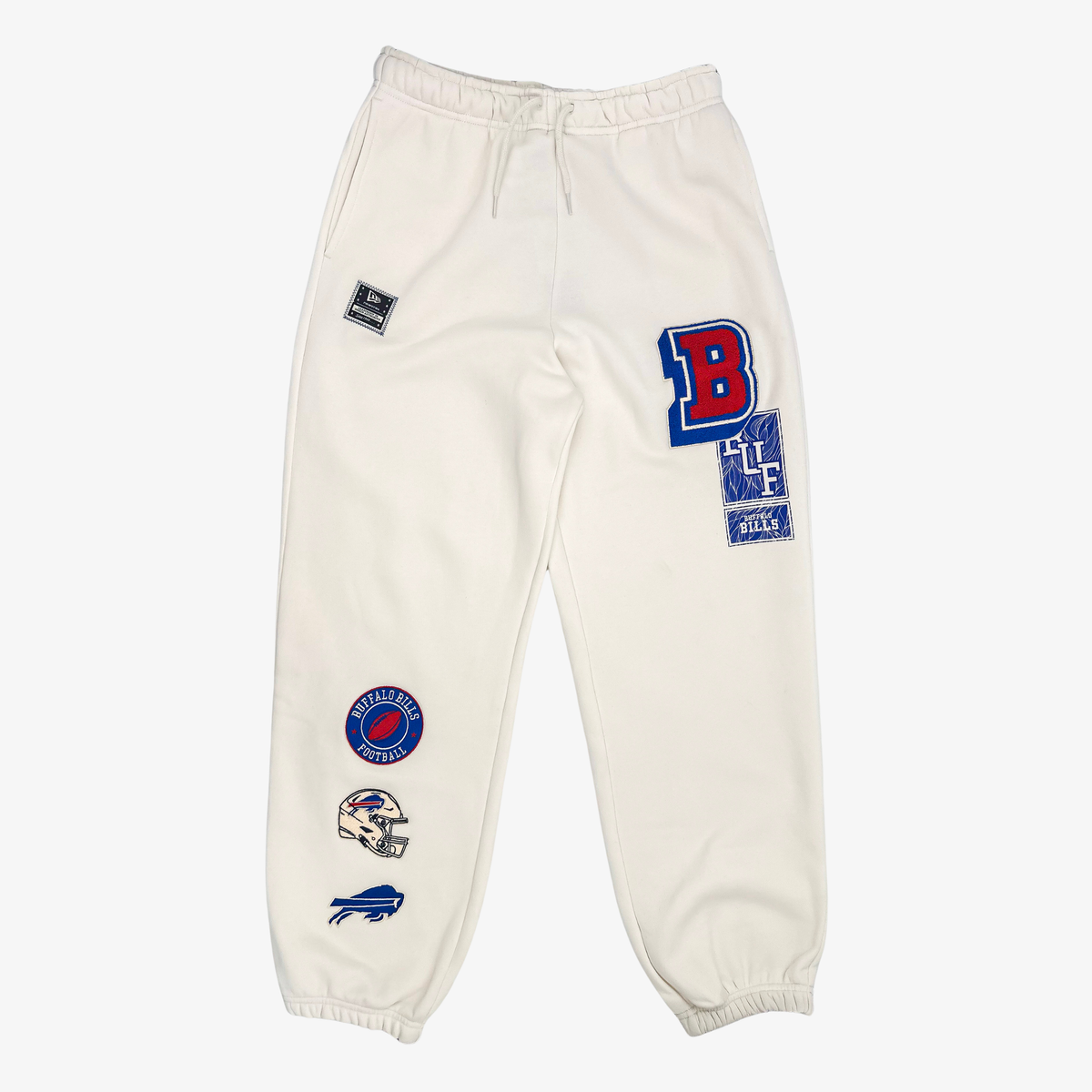 New Era women's Buffalo Bills cream jogger sweatpants with colorful vintage-inspired team patches, drawstring waist and elastic cuffs