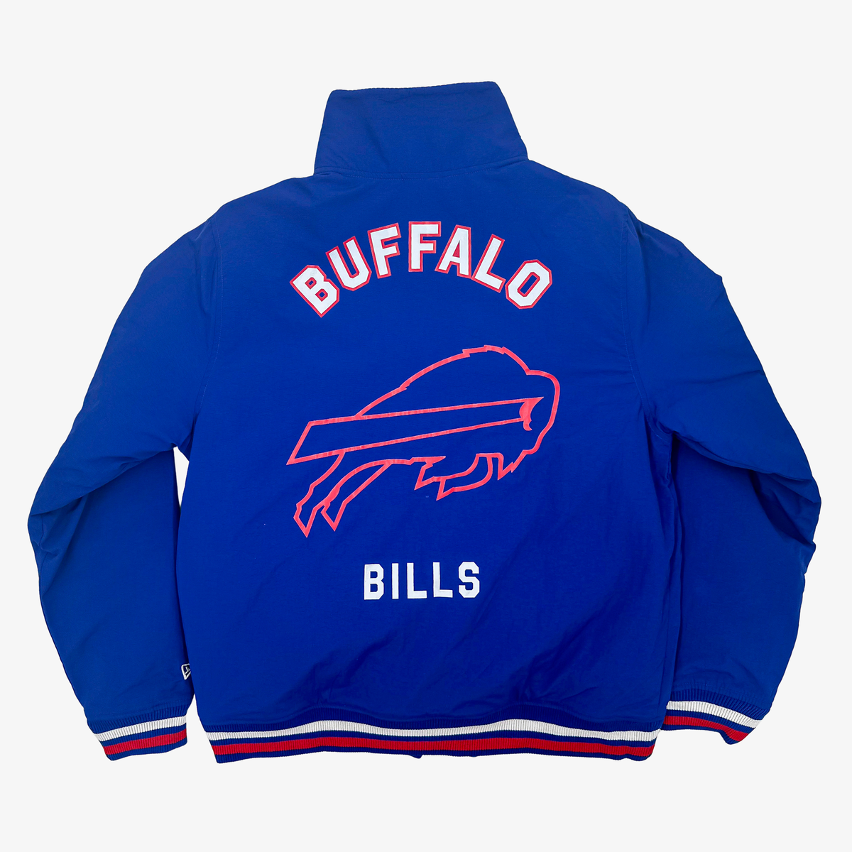 Back of New Era Buffalo Bills royal blue warm-up jacket featuring arched Buffalo lettering, oversized charging buffalo logo, and striped ribbed hem.