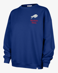 '47 Brand Buffalo Bills women's royal blue oversized crewneck sweatshirt featuring a small white charging buffalo logo and red Buffalo Bills script on the chest.