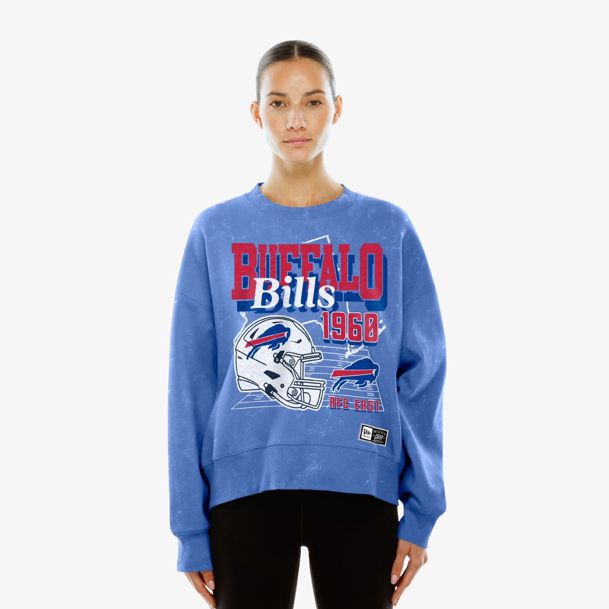 Woman wearing a New Era Buffalo Bills royal wash crewneck with 1960 helmet graphic
