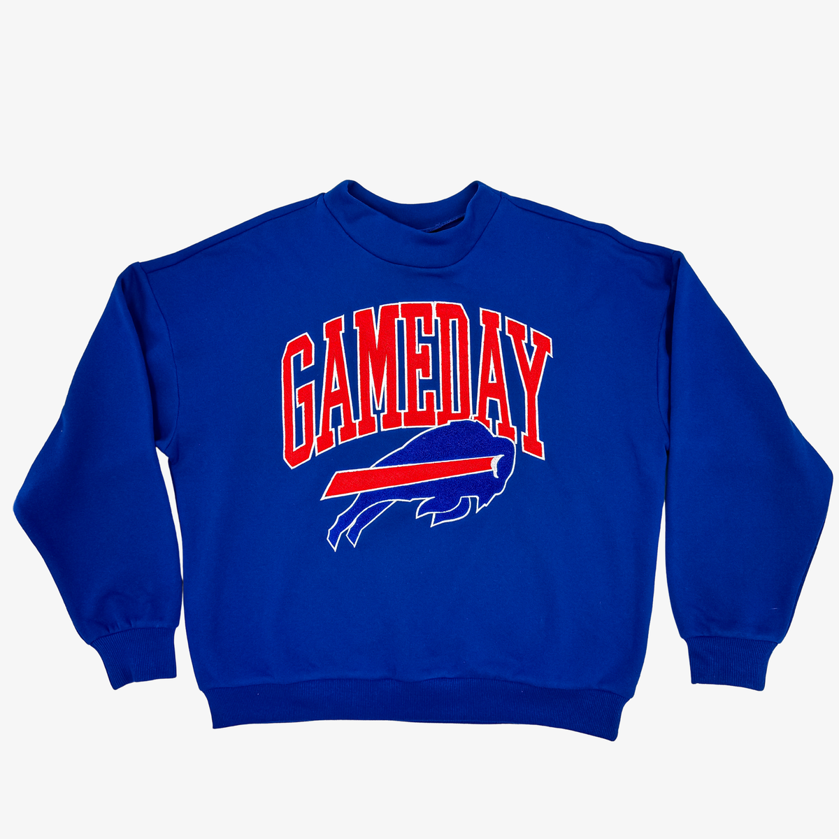 Women's Buffalo Bills royal blue crewneck sweatshirt with oversized red GAMEDAY lettering, charging buffalo logo, dropped shoulders, and ribbed cuffs.