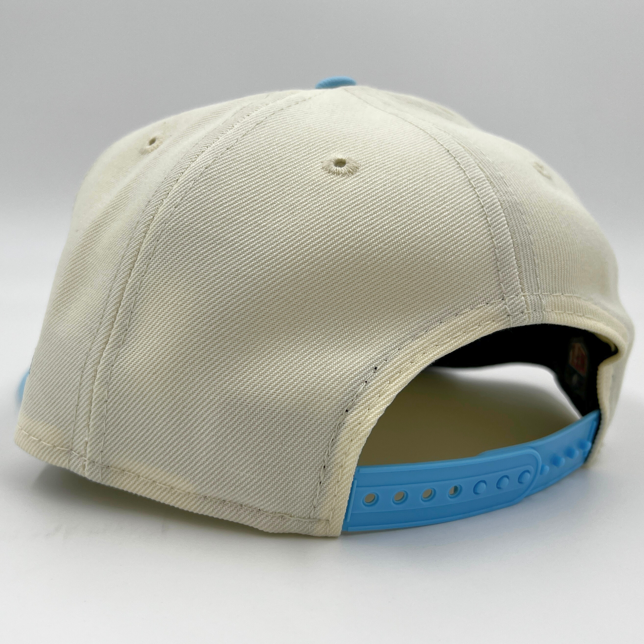 New Era Bills 9Fifty Cream, Light Blue, & Pink 2023 Colorpack Snapback Hat