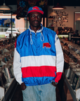 The Killers x The BFLO Store royal blue, red and white chute jacket with standing buffalo patch and zippered front