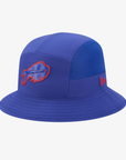 A royal blue Buffalo Bills performance bucket hat by New Era, featuring a red and blue charging buffalo logo on the front and a small red New Era flag logo on the side, set against a light gray background.