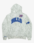 Mitchell & Ness Buffalo Bills Ghosted Camo Pullover Hoodie in white and light gray woodland camouflage with blue BILLS lettering, 1960 patch, and sleeve logo.