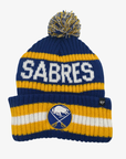 '47 Brand Buffalo Sabres navy blue pom knit hat featuring white SABRES lettering, gold stripes, embroidered crossed-swords logo, and multicolored pom.