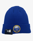 New Era Buffalo Sabres royal blue ribbed cuffed knit hat featuring a crossed-swords team logo embellished with sparkling rhinestones and gold embroidery.