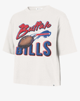 '47 Brand Buffalo Bills women's cream cropped T-shirt featuring distressed Buffalo script, a football illustration, charging buffalo logo, and bold Bills lettering.