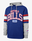 '47 Brand Buffalo Bills royal blue and heather gray pullover hoodie featuring oversized Bills 1960 graphics, red and white striped jersey sleeves, and a layered design.