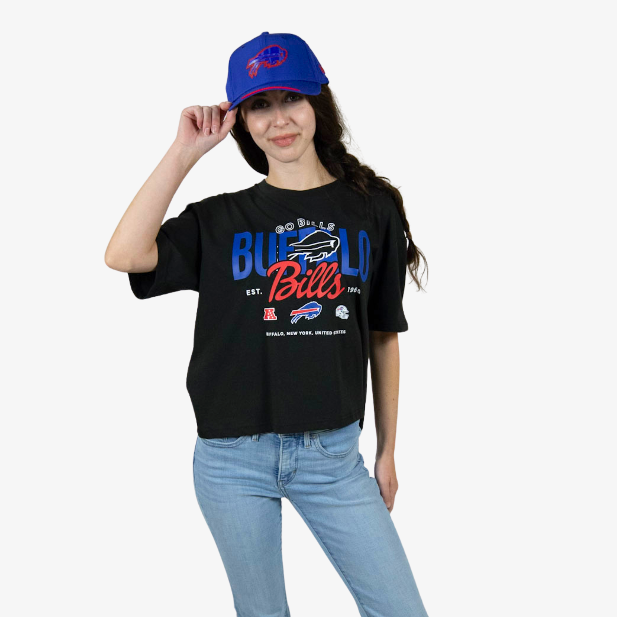 A woman modeling a black Buffalo Bills graphic t-shirt and a blue baseball cap against a plain white background.