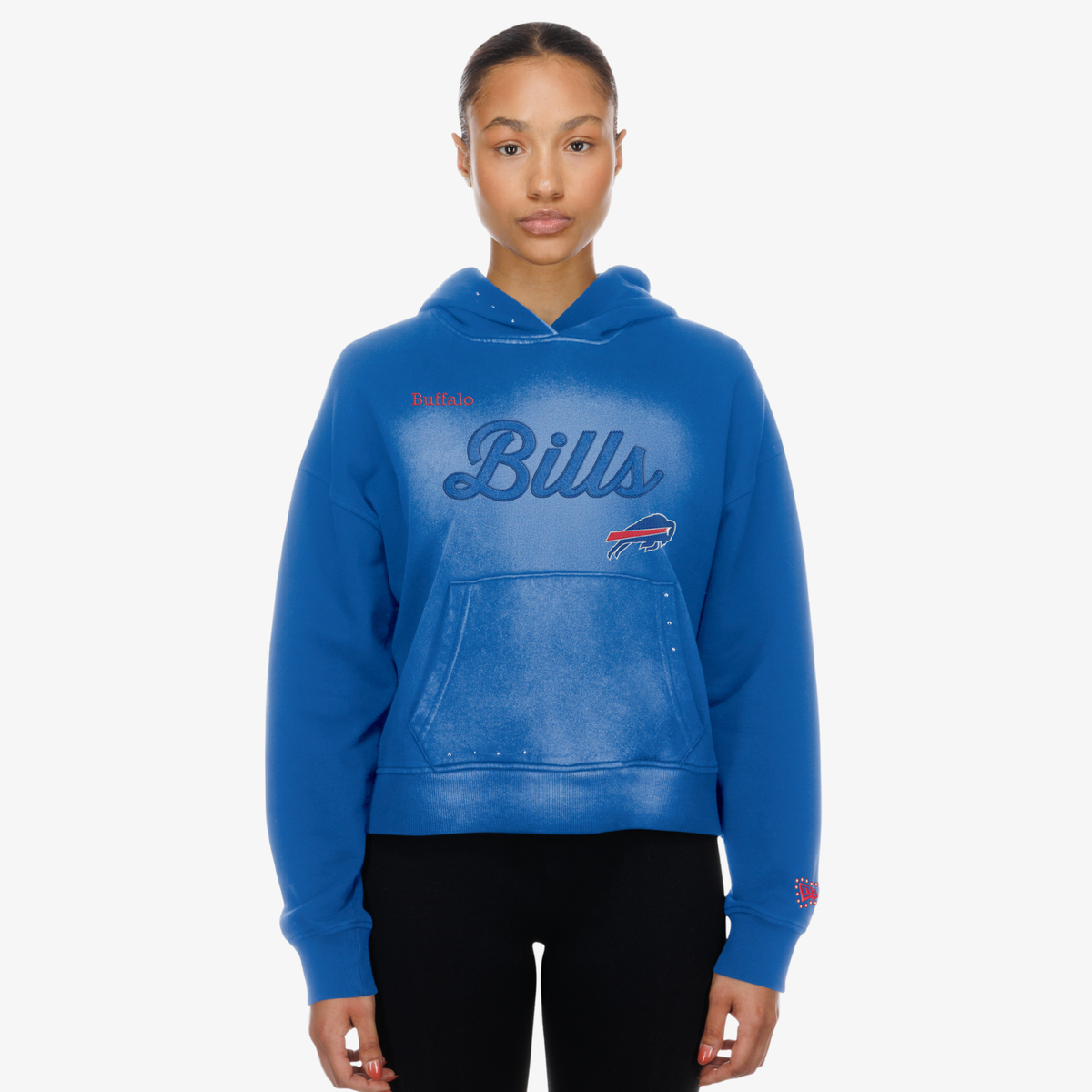 New Era Women's Buffalo Bills royal blue pullover hoodie with tonal Bills script lettering, faded wash effect, charging buffalo logo, and front kangaroo pocket.