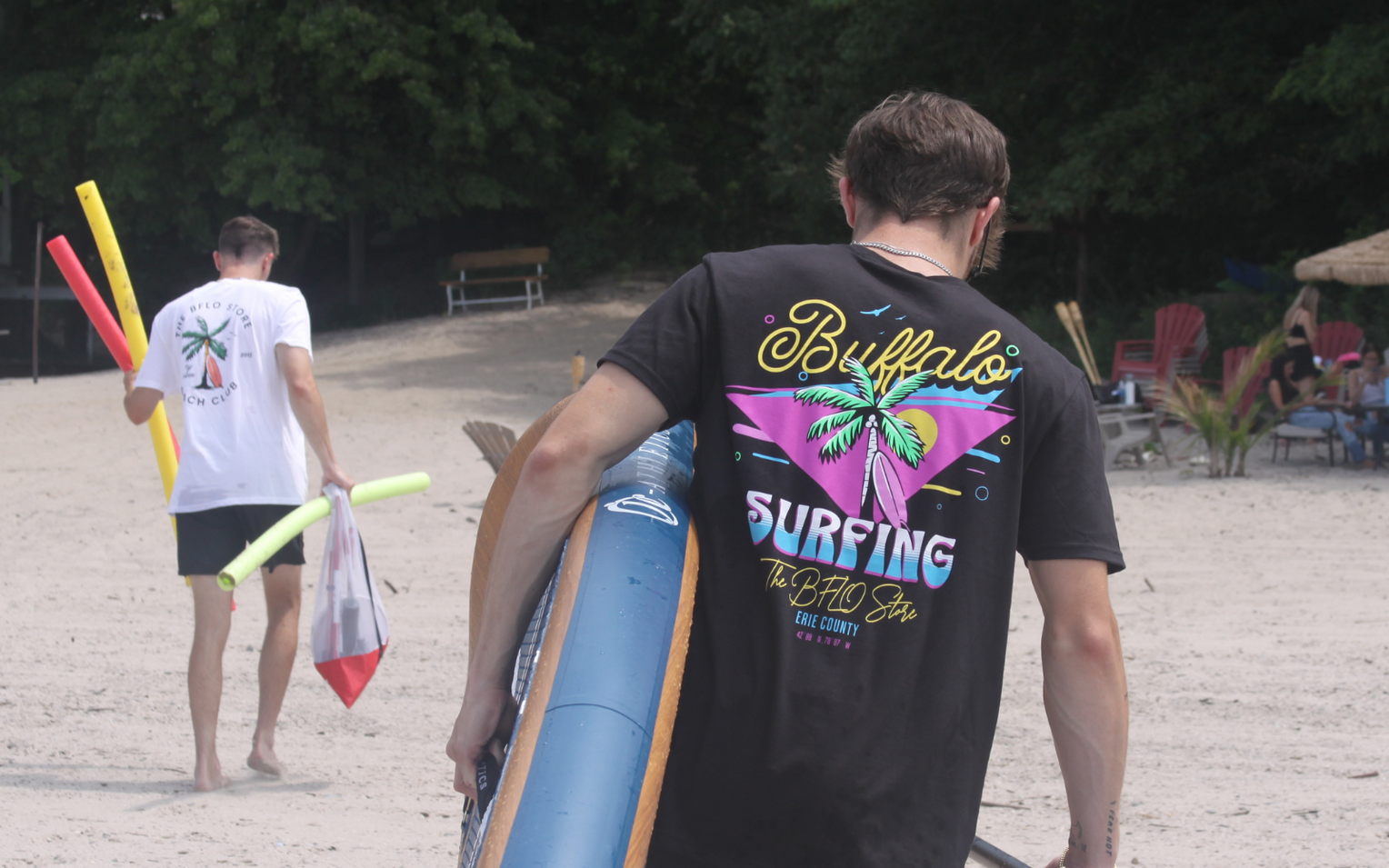 two guys at the beach wearing bflo beach club apparel